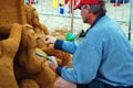 A sand sculptor carving the details