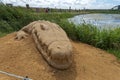 Sand sculpture of a big crocodile