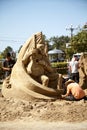 Sand sculpture festival - artists working on a man figure