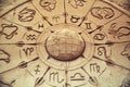 Sand sculpture of globe and zodiac signs