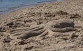 Sand sculpture of an octopus on the sea beach on a sunny day Royalty Free Stock Photo