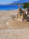 Sand Sculpture on the quiet beach in November in Marbella Andalucia Spain Royalty Free Stock Photo