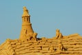 A sand sculpture of roof, chimney and cats at the famous sand festival Fiesa in Algarve, Portugal