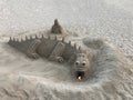 A sand sculpture in the shape of a dragon on the beach Royalty Free Stock Photo