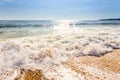 Sand sea beach and blue sky after sunrise and splash of seawater Royalty Free Stock Photo