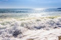 Sand sea beach and blue sky after sunrise and splash of seawater Royalty Free Stock Photo