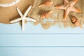 Sand and shells on the wooden floor of the blue,summer concept Royalty Free Stock Photo