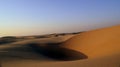 The Sand and Sky of the Arabian Desert as the Sun Begins to Set