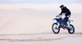 Sand, speed or athlete driving motorbike for action, adventure or fitness with performance or adrenaline. Fast, nature Royalty Free Stock Photo