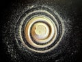Sand spiral on the black background. The concept of rotation, golden ratio, galaxy Royalty Free Stock Photo