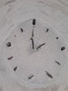 Sand and stick beach clock face 2 o clock Royalty Free Stock Photo