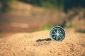 Sand surrounds the compass, capturing the essence of exploration and adventure Royalty Free Stock Photo