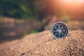 Sand surrounds the compass, capturing the essence of exploration and adventure Royalty Free Stock Photo