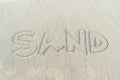 SAND text on sand