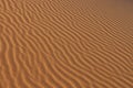 Sand texture - background of desert sand dunes. Beautiful structures of sandy dunes. sand with wave from wind in desert Royalty Free Stock Photo