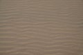 Sand texture background with natural sandy line water wave in low tide beach pattern wallpaper Royalty Free Stock Photo