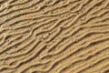 Sand texture background. Wet sand with abstract wave pattern Royalty Free Stock Photo