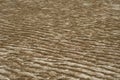 Sand texture. Close up repeating texture of waves on black sand beach at mangrove forest during low tide period, Endau, Malaysia