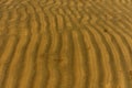 Sand texture design on sea beach for background. Wave pattern of ocean sand on the beach Royalty Free Stock Photo