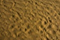 Sand texture design on sea beach for background. Wave pattern of ocean sand on the beach Royalty Free Stock Photo