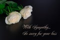 Deepest condolence white flowers on black background with text Royalty Free Stock Photo