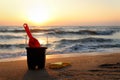 Sand toys for making sand castle on sandy beach in sea shore at sunset time , summer holiday vacation at tropical island Royalty Free Stock Photo