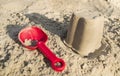 Sand toys, a red bucket and a scoop on the sand, Royalty Free Stock Photo