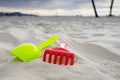 Sand toys on the white sandy beach Royalty Free Stock Photo