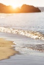 Sand and wave background at sunrise