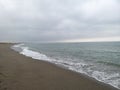 Sand and waves sea and beach stormy day Royalty Free Stock Photo