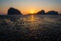 Sand waves texture with reflection of sunset on the Pak Meng beach, Trang, Thailand