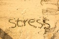 Sand writing done with word stress written on sand at a beach Royalty Free Stock Photo