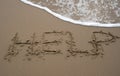 Sand writing - HELP 2 Royalty Free Stock Photo