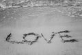 On the sand written word and his love washes wave, black and white