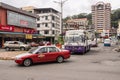 Sandakan, Malaysia - January 05, 2022: Old taxi in the town of Sandakan. Driving cab in city traffic. Public transport at Sabah,