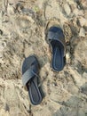 sandals on the beach sand. enjoy a vacation on the beach