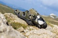 Pair of hiking sandals and mountain landscape on background Royalty Free Stock Photo