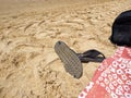 Sandals flip-flop on the beach Royalty Free Stock Photo