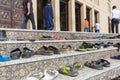 Sandals outside a mosque during prayer time in Dubai.