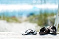 Sandals taken off and left on boardwalk Royalty Free Stock Photo