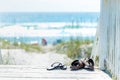 Sandals taken off and left on boardwalk Royalty Free Stock Photo