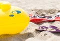 Sandals towel and boat on the sand Royalty Free Stock Photo