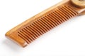 Sandalwood comb on a white background. Hair care. Royalty Free Stock Photo