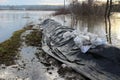 Sandbags flood protection barely holding river back at sunset