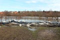 Sandbags flood protection holding back water from flooded river