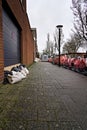 Sandbags for garage and house doors to prevent flooding in dutch street in Hoorn 2024