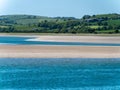 A sandbank at low tide, spring. The sea water is a beautiful turquoise color. Sea coast, landscape