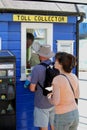 Sandbanks, Dorset, England - June 02 2018: Man and woman queueing in line at the ticket or toll collector booth for the Sandbanks