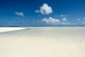 Sandbar flooded with clear water, blue sky with white clouds, very small island in Southern Pacific Ocean, Aitutaki, Cook Islands