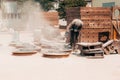 Sandblasting at an industrial plant, a worker knocks down oxide and dirty rust with sand under air pressure from a hose Royalty Free Stock Photo